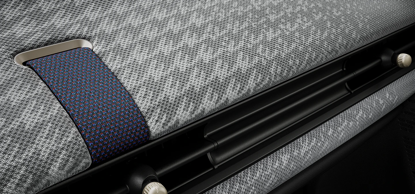 Grande plano do cockpit em tecido de malha 2D no interior do MINI Cooper.