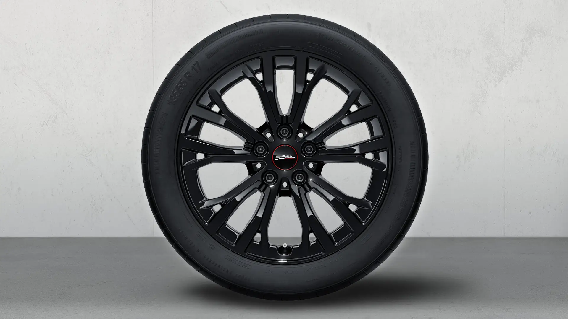 Roda com pneu de inverno e jante de liga leve John Cooper Works 991 com raios Star de 17" em preto Jet.