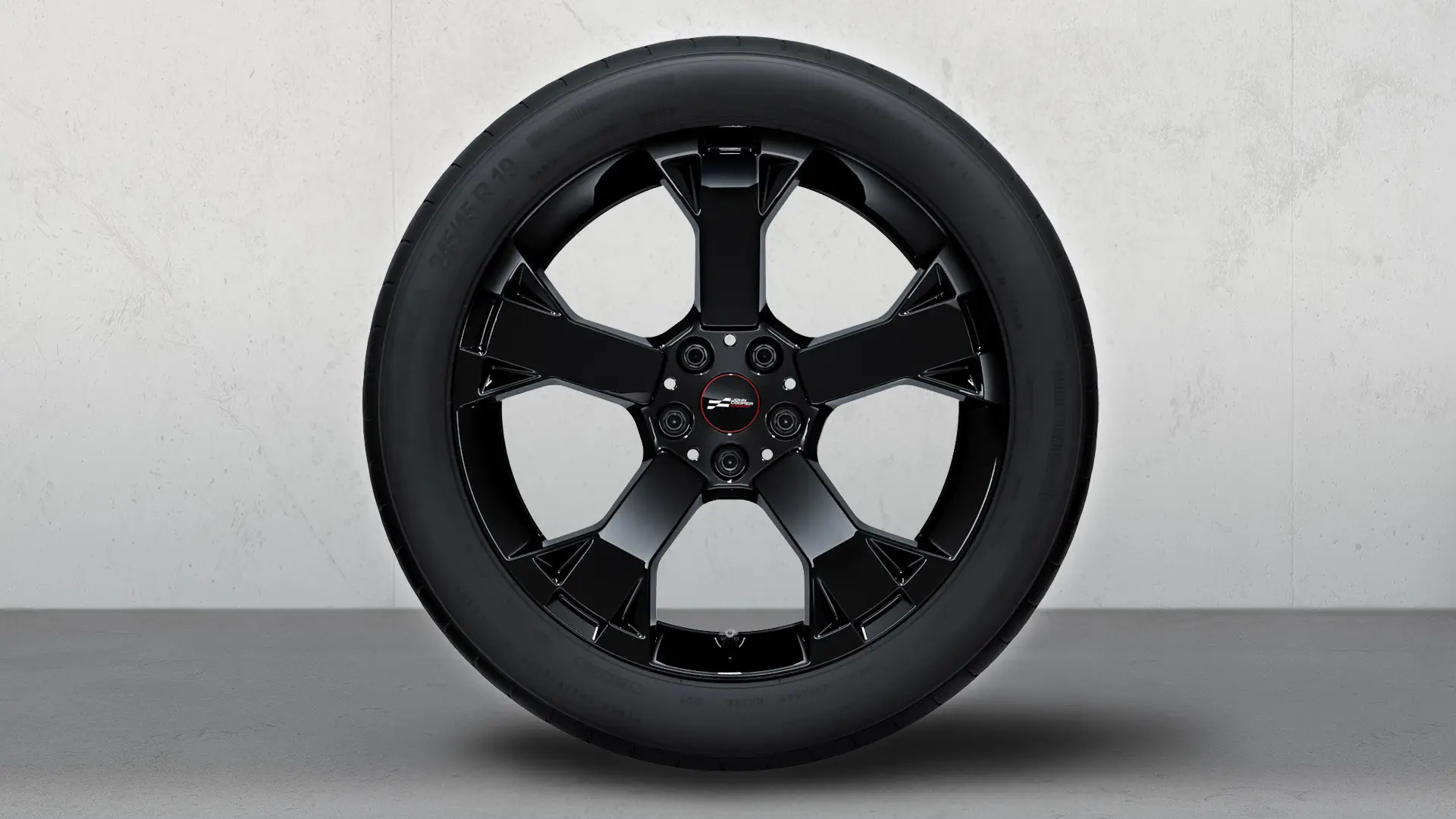 Roda com pneu de inverno e jante de liga leve John Cooper Works 948 com raios Runway de 19" em preto Jet.