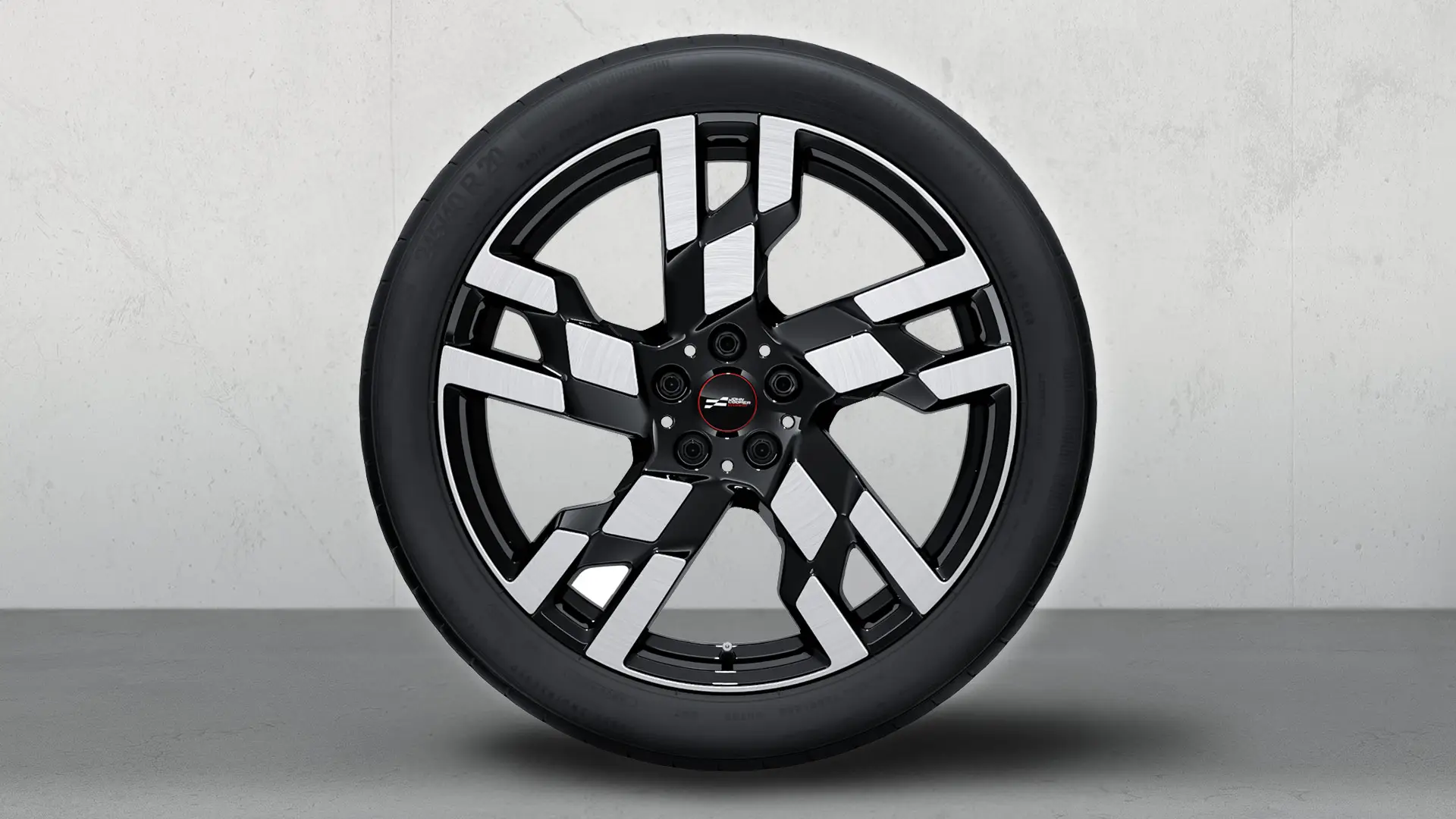 Roda com pneu de inverno e jante de liga leve John Cooper Works 949 com raios Flag de 20'' em preto Jet bicolor, torneada brilhante. 