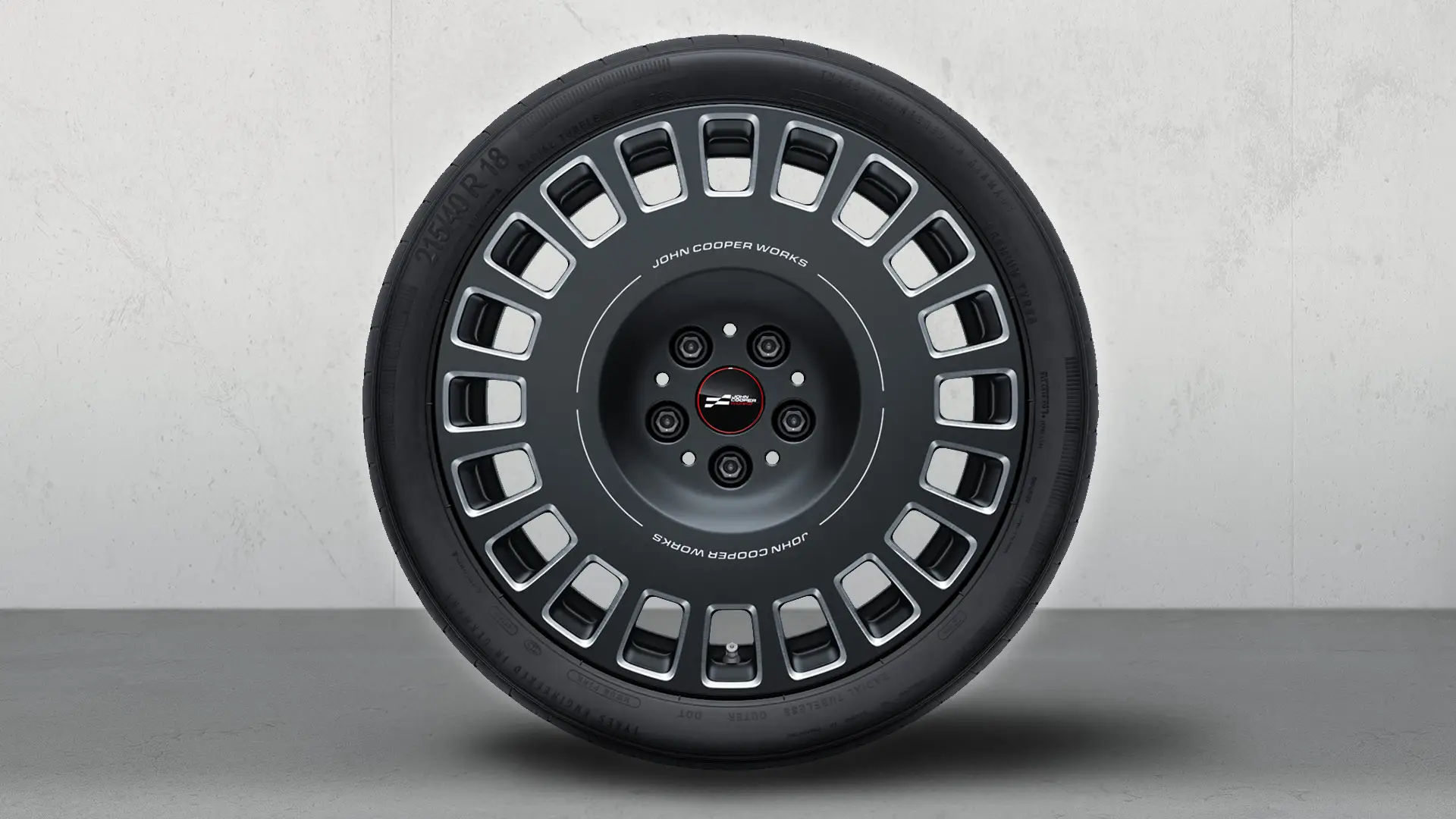 Conjunto completo de rodas de verão com jantes de liga leve JCW Rallye Spoke 964, de 18", em Frozen Midnight Grey bicolor, polidas