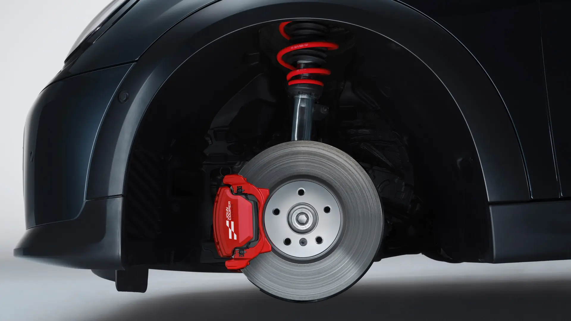 Suspensão desportiva MINI John Cooper Works com molas em Chili Red John Cooper Works.