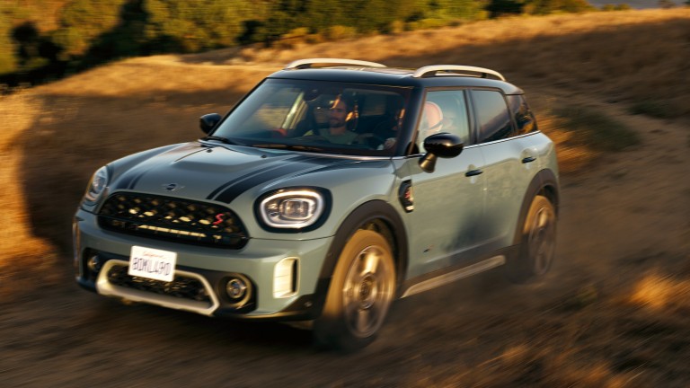 MINI Countryman drives up a mountain road with All4 All-Wheel Drive.